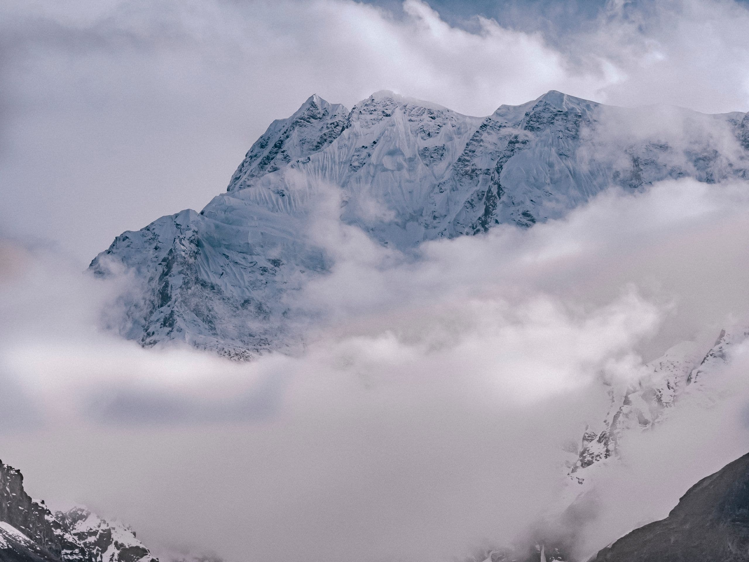 Majestic snowcapped mountain in clouds